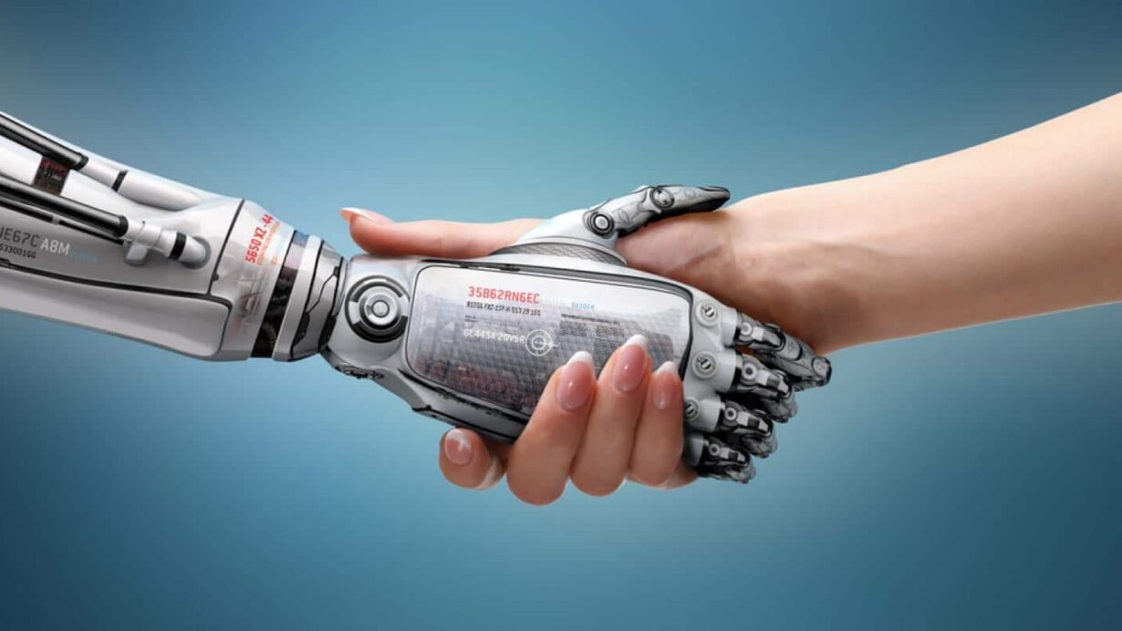 Poignée de main entre une main humaine et une main robotique