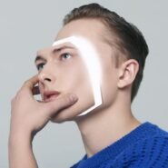 Visage avec un effet lumineux géométrique sur la joue