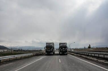 blue and white truck on road during daytime