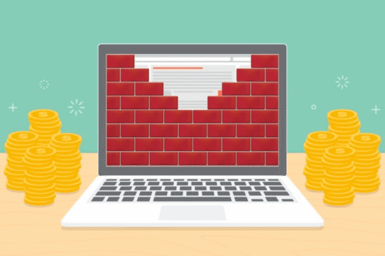 Ordinateur avec mur de briques et piles de pièces d'or
