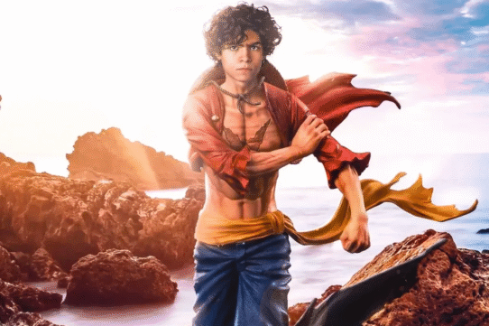 Un personnage animé debout sur des rochers au bord de la mer au coucher du soleil