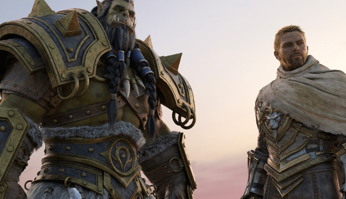 Deux personnages en armure se tenant côte à côte au coucher du soleil