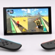 Console de jeu avec écran affichant une course et deux manettes