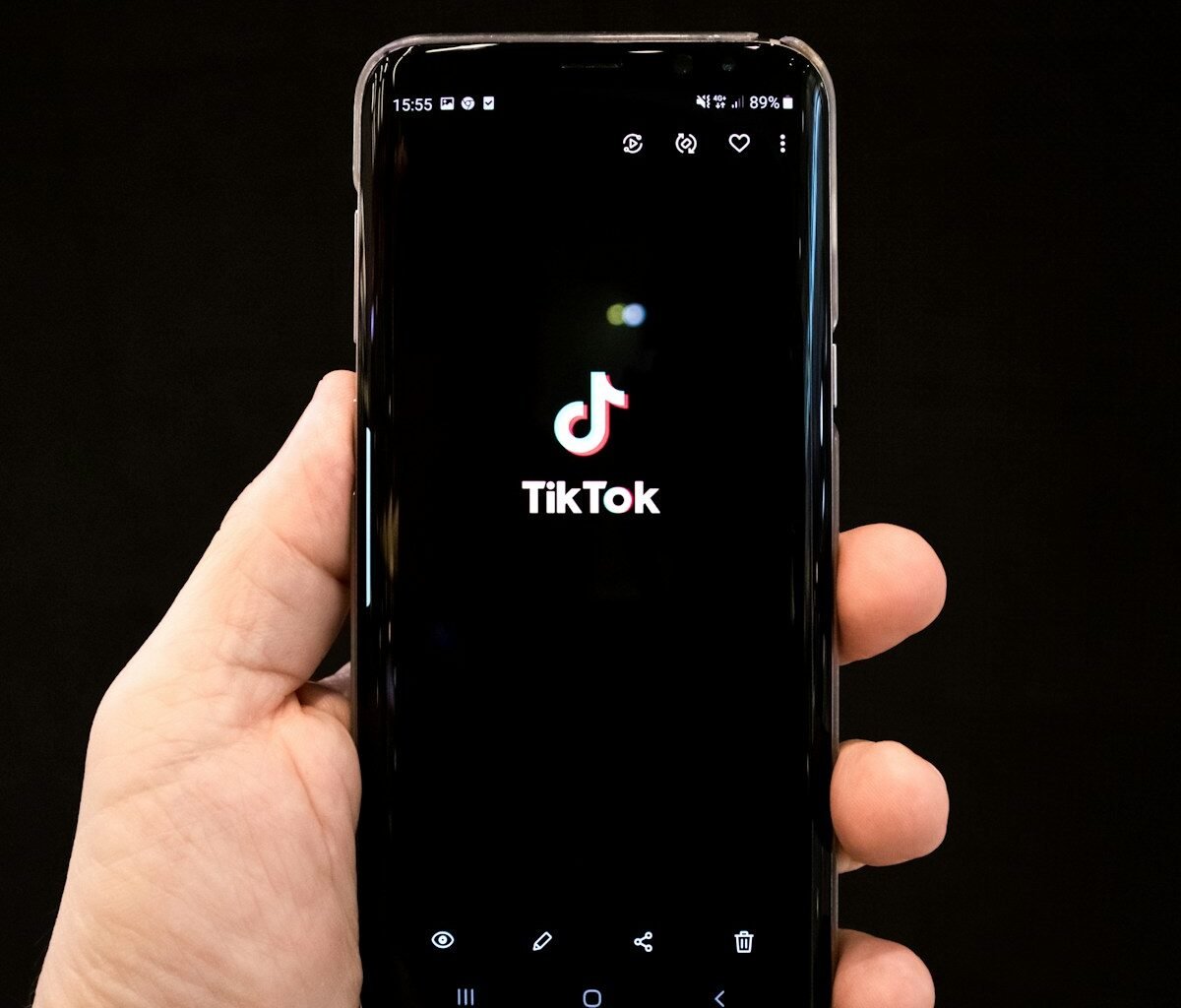 black android smartphone displaying 12 00